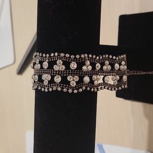 Ladies black bracelet with rhinestones.